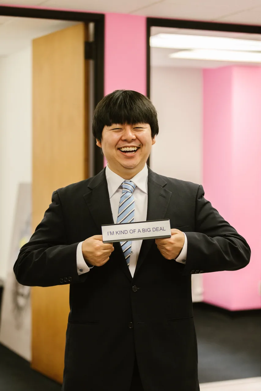 Professional holding a business card after career coaching